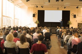 Trainer in front of large audience